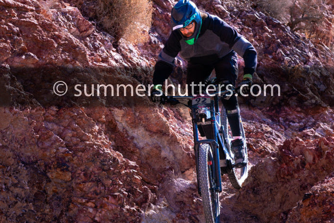 4LEAF rider descending a mountain trail on a Rocksoul electric mountain bike